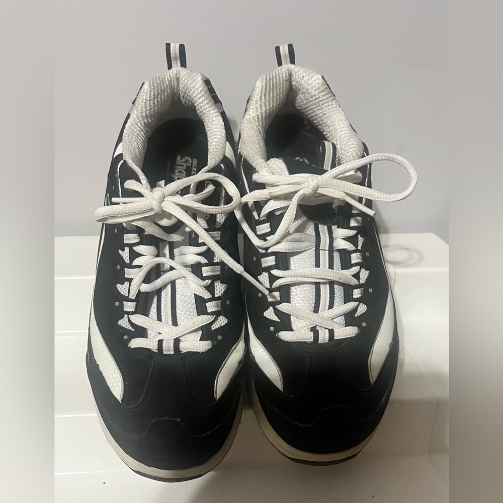Shape Ups in Black and White with Significant wear on the side of the sole!